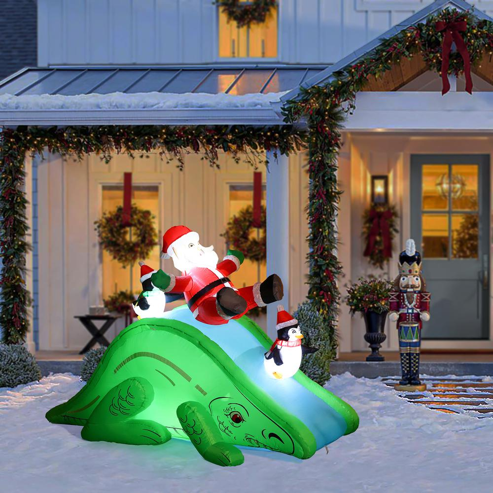 Santa and Penguins Trio Sliding on a Dinosaur Inflatable Holiday Decoration