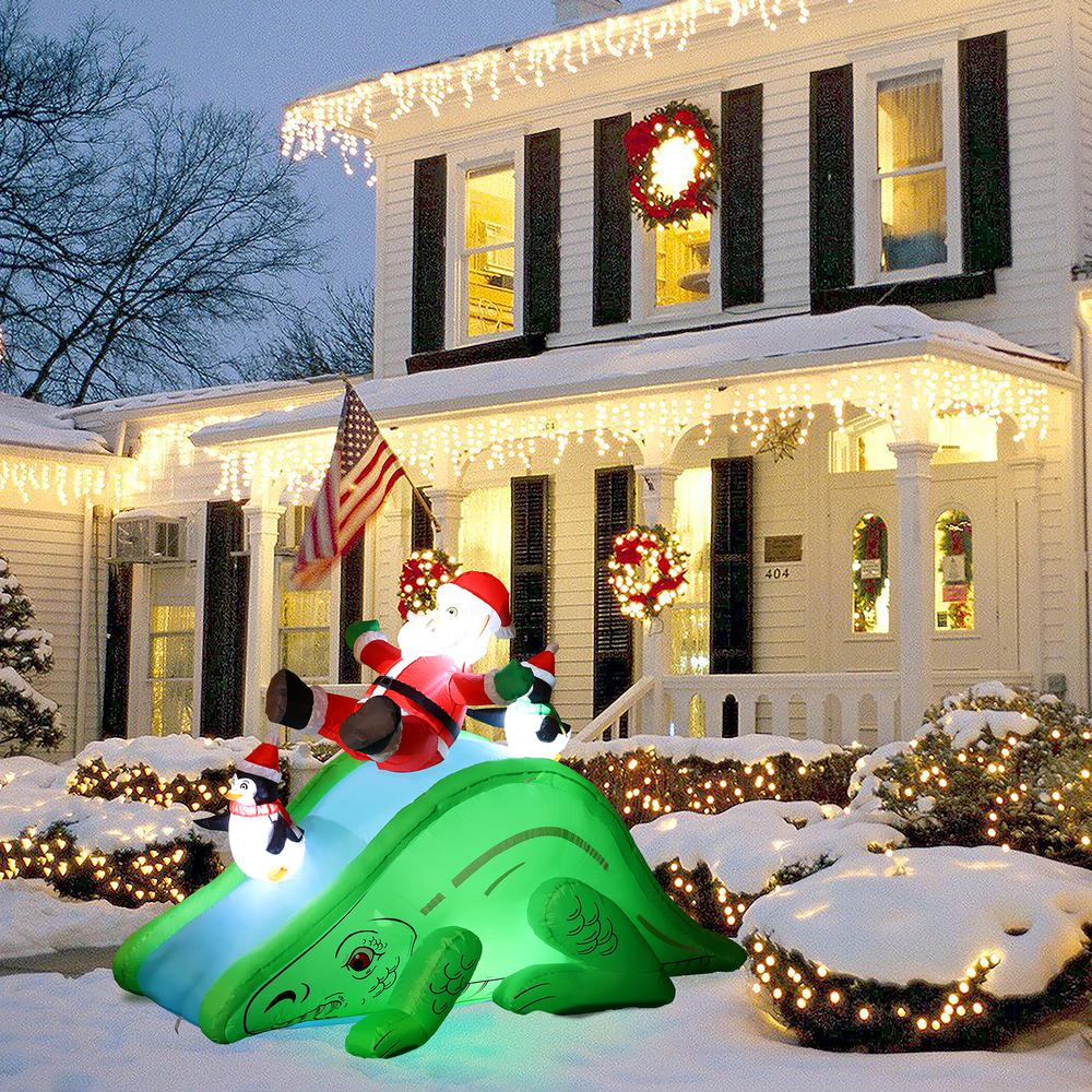 Santa and Penguins Trio Sliding on a Dinosaur Inflatable Holiday Decoration